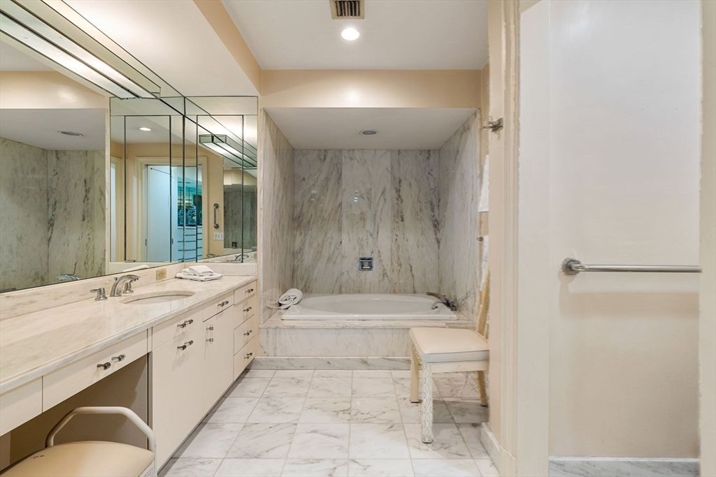 Bathroom, Dual Sink Vanities, Glass Shower, Interior, Marble, Marble Walls, Recessed Lighting
