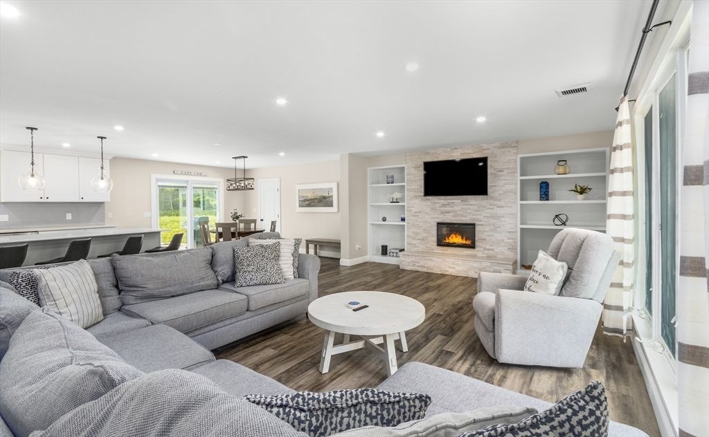 Dining room, Fireplace, Interior, Living room, Pendant Lights, Recessed Lighting, Stone Walls, Wood Texture Flooring