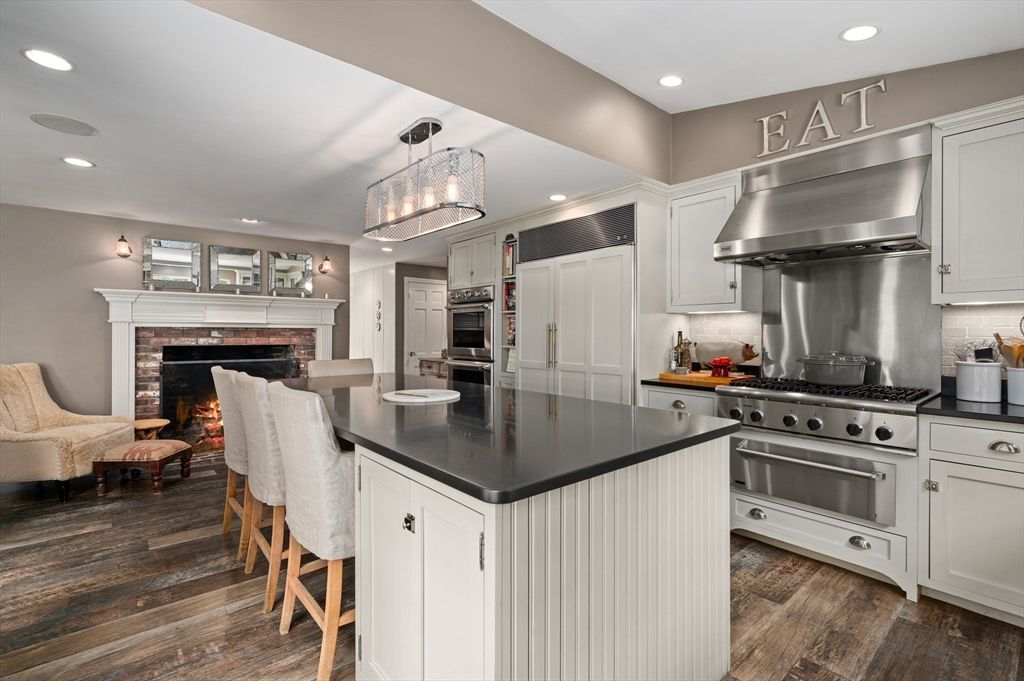 Fireplace, Interior, Kitchen, Pendant Lights, Recessed Lighting, Stainless Steel Appliances, Wood Texture Flooring