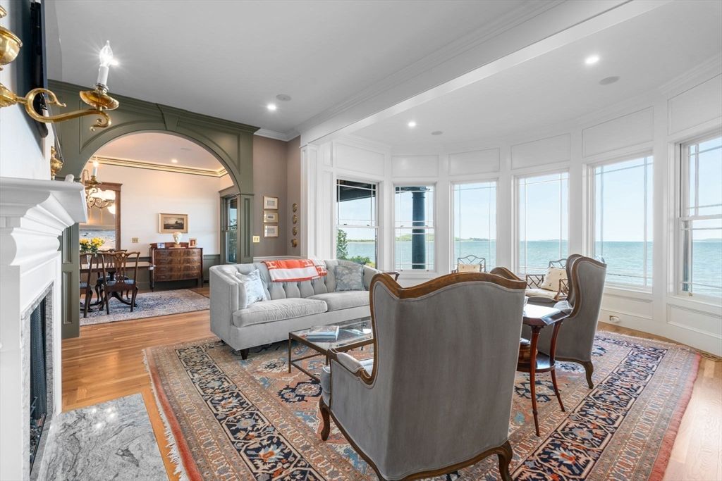 Dining room, Fireplace, Interior, Living room, Recessed Lighting, Water, Wood Texture Flooring