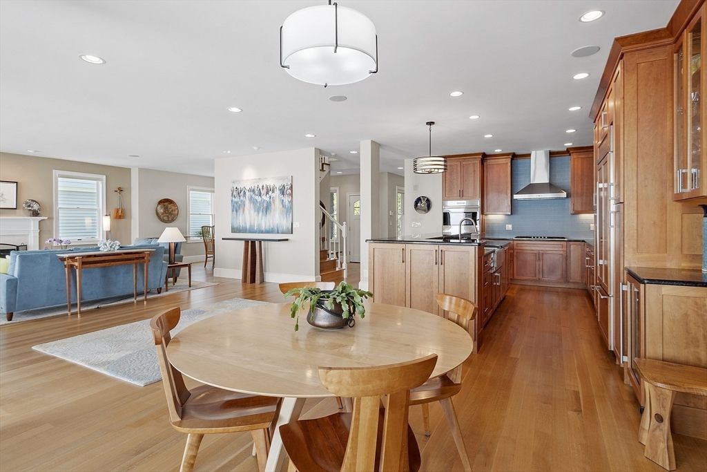 Dining room, Fireplace, Interior, Kitchen, Living room, Pendant Lights, Recessed Lighting, Stainless Steel Appliances, Wood Texture Flooring