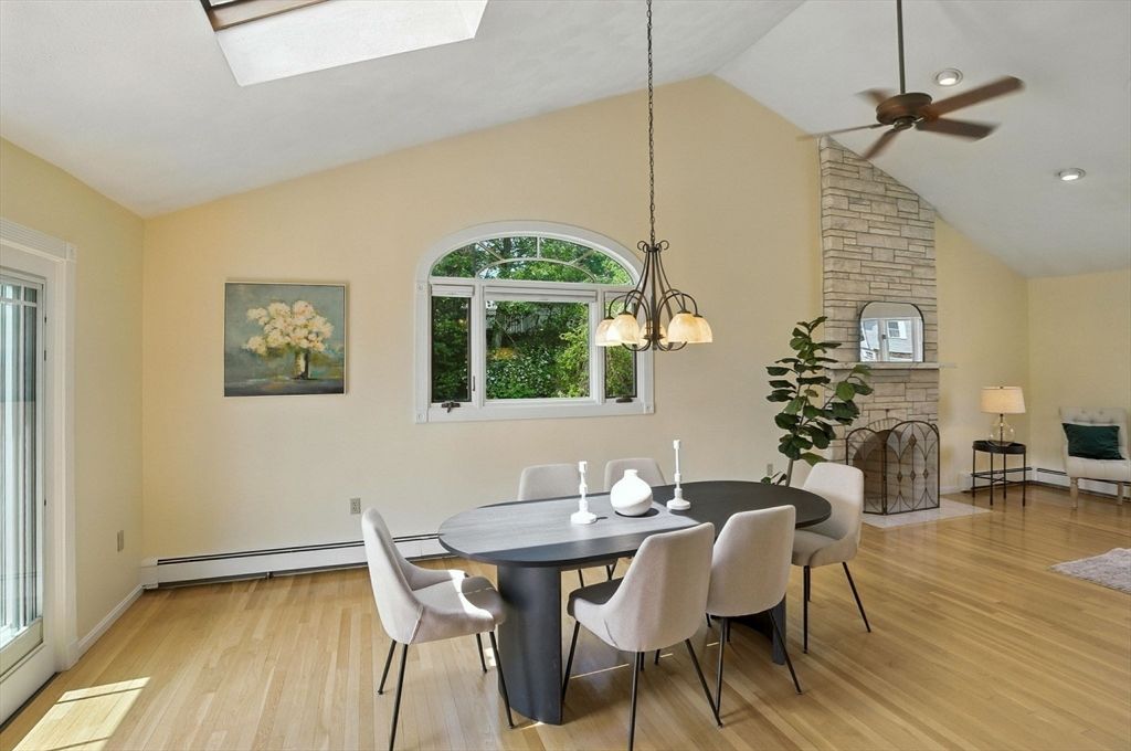 Dining room, Fireplace, Interior, Pendant Lights, Recessed Lighting, Stone Walls, Wood Texture Flooring
