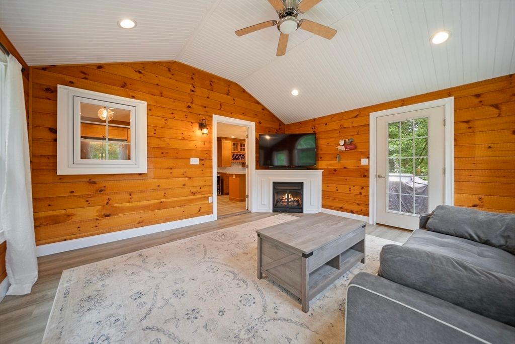 Fireplace, Interior, Living room, Recessed Lighting, Wood Texture Flooring, Wooden Walls