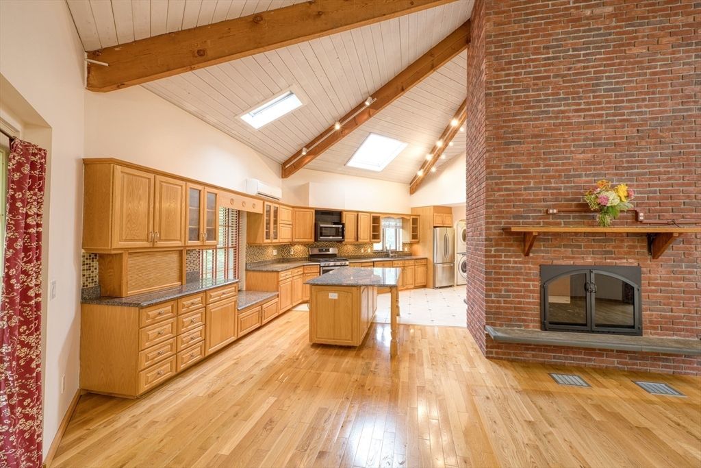 Fireplace, Interior, Kitchen, Stainless Steel Appliances, Stone Walls, Wooden Beams, Wood Texture Flooring