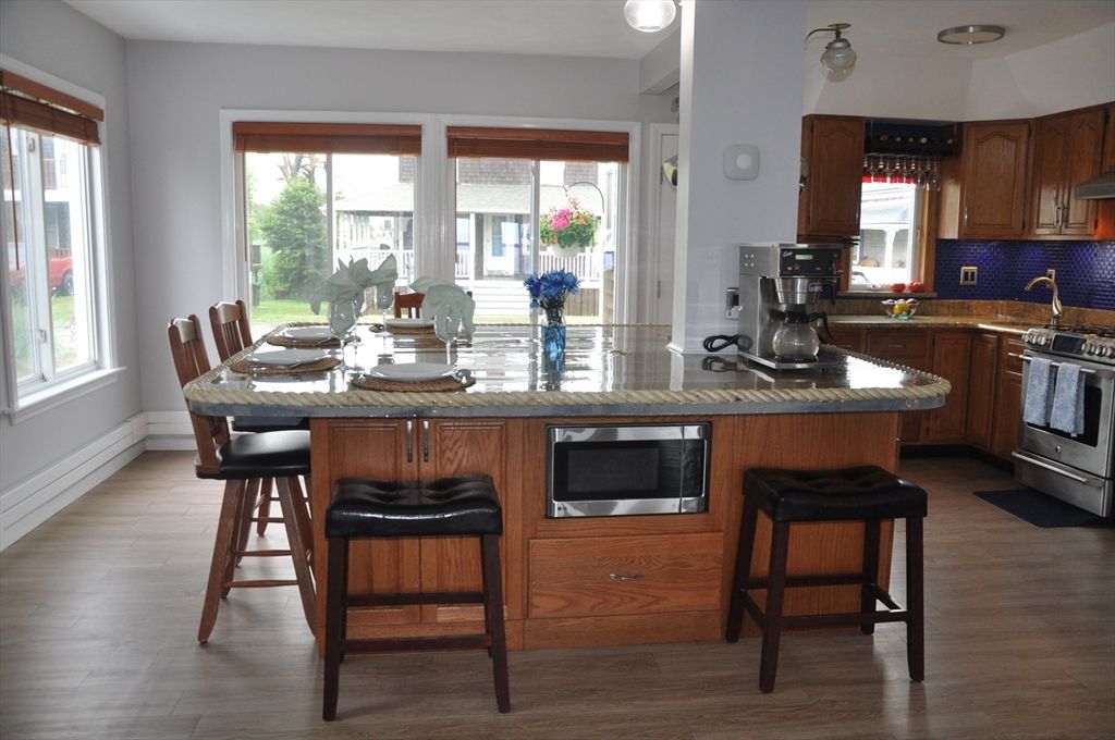 Dining room, Interior, Kitchen, Recessed Lighting, Stainless Steel Appliances, Wood Texture Flooring