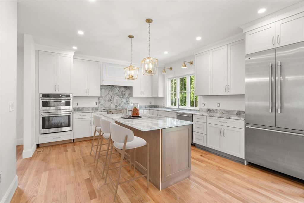 Interior, Kitchen, Marble Walls, Pendant Lights, Recessed Lighting, Stainless Steel Appliances, Wood Texture Flooring