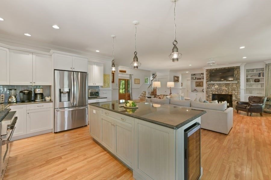 Fireplace, Interior, Kitchen, Living room, Pendant Lights, Recessed Lighting, Stainless Steel Appliances, Stone Walls, Wood Texture Flooring