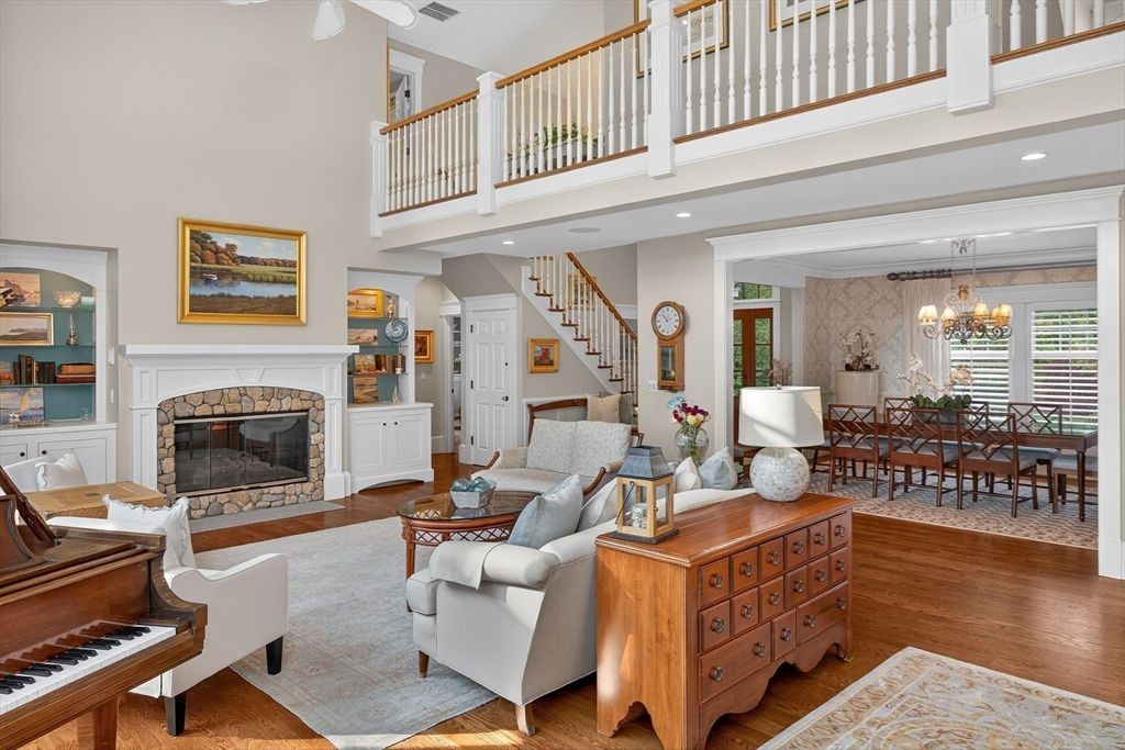 Chandelier, Dining room, Fireplace, Interior, Living room, Piano, Recessed Lighting, Wood Texture Flooring