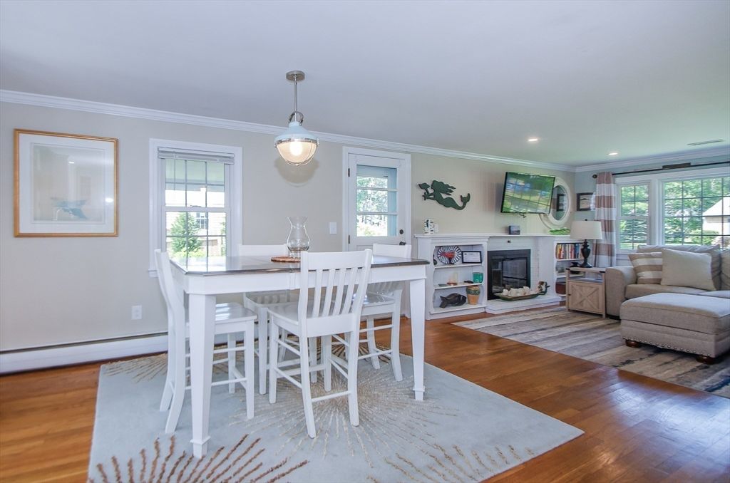 Dining room, Fireplace, Interior, Living room, Pendant Lights, Recessed Lighting, Wood Texture Flooring