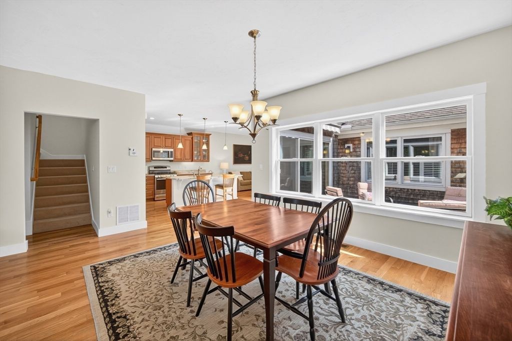 Chandelier, Dining room, Interior, Kitchen, Pendant Lights, Stainless Steel Appliances, Wood Texture Flooring