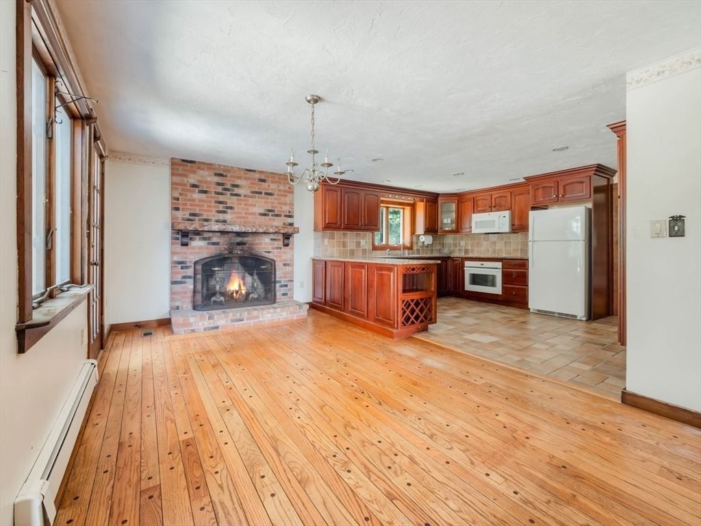 Chandelier, Fireplace, Interior, Kitchen, Pendant Lights, Stone Walls, Wood Texture Flooring