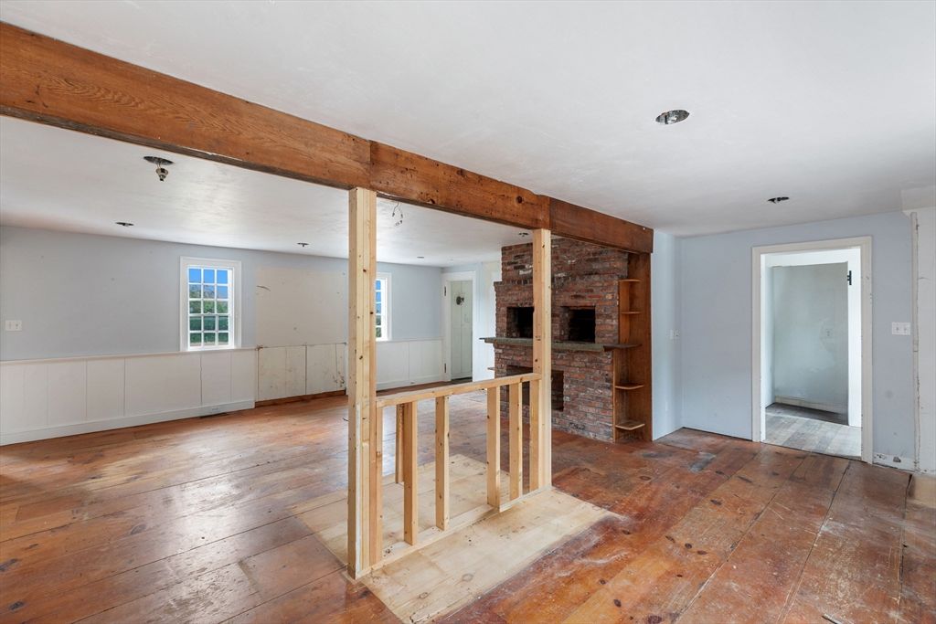 Empty room, Fireplace, Interior, Recessed Lighting, Stone Walls, Wood Texture Flooring