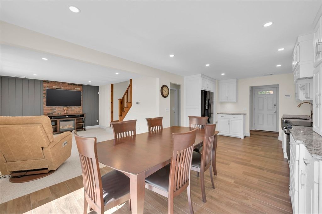 Dining room, Fireplace, Interior, Kitchen, Living room, Recessed Lighting, Wood Texture Flooring