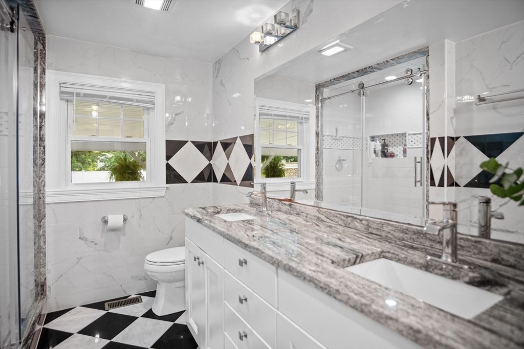 Bathroom, Dual Sink Vanities, Glass Shower, Interior, Marble Walls, Recessed Lighting