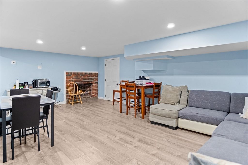 Dining room, Fireplace, Interior, Living room, Recessed Lighting, Wood Texture Flooring