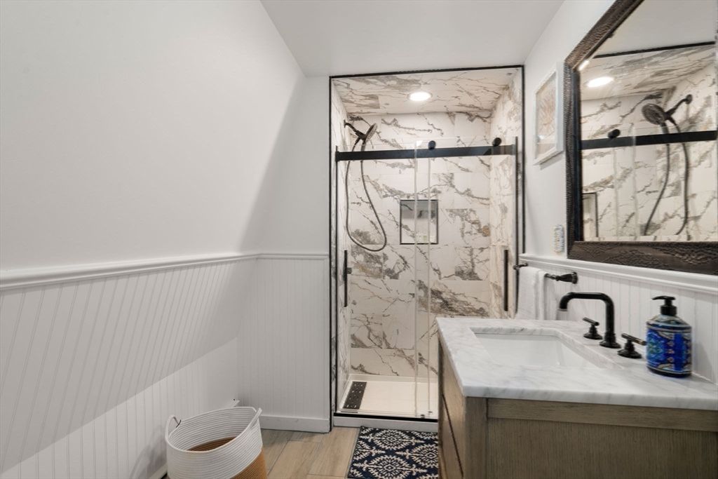 Bathroom, Glass Shower, Interior, Marble Walls, Recessed Lighting, Wood Texture Flooring