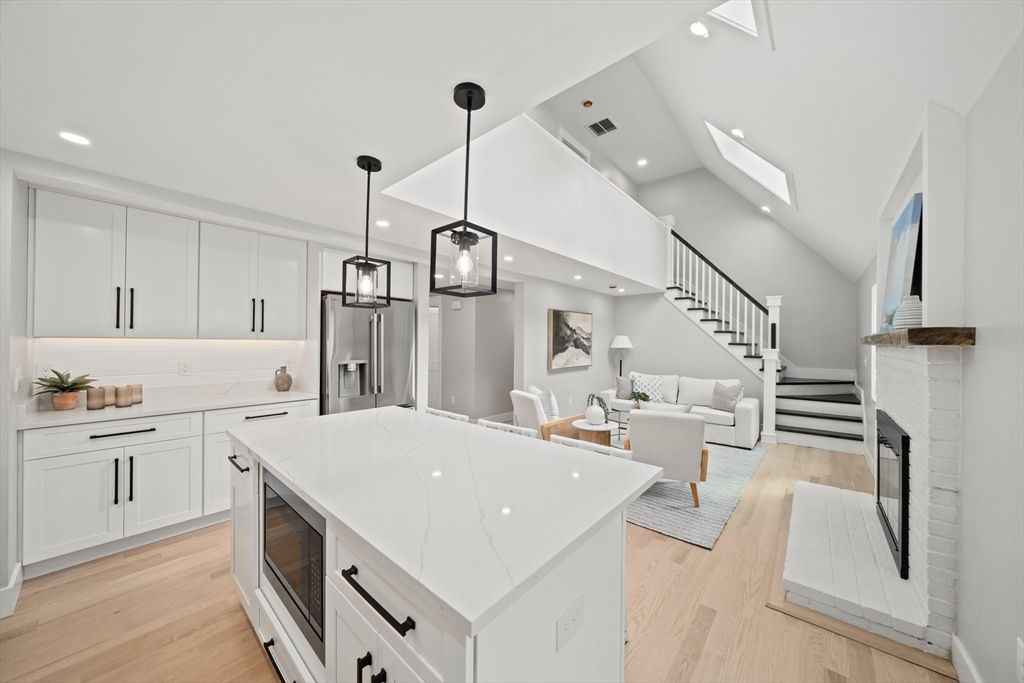 Fireplace, Interior, Kitchen, Living room, Pendant Lights, Recessed Lighting, Stainless Steel Appliances, Wood Texture Flooring