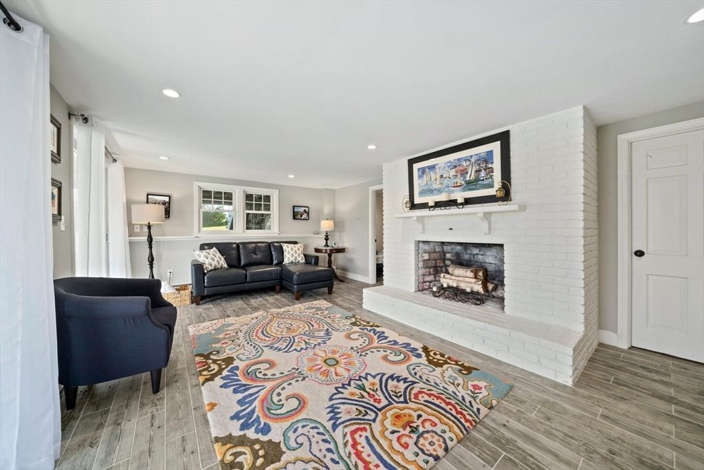 Fireplace, Interior, Living room, Recessed Lighting, Stone Walls, Wood Texture Flooring