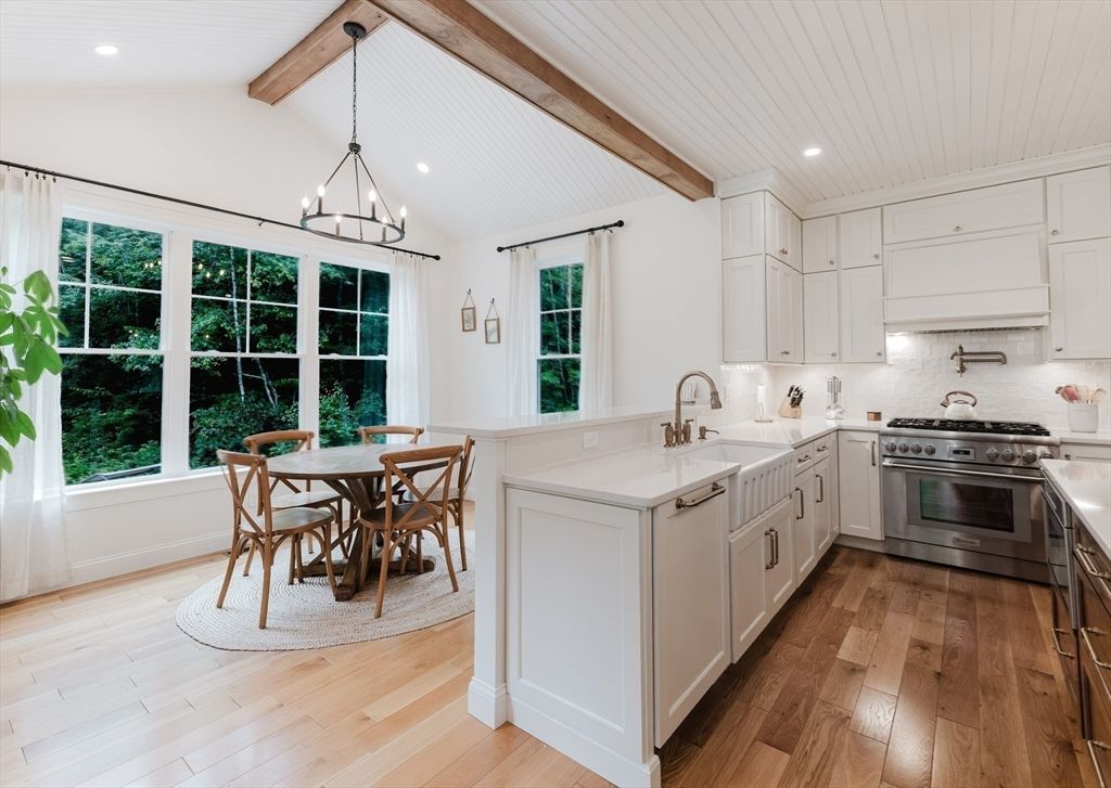 Chandelier, Dining room, Interior, Kitchen, Pendant Lights, Recessed Lighting, Stainless Steel Appliances, Wooden Beams, Wood Texture Flooring