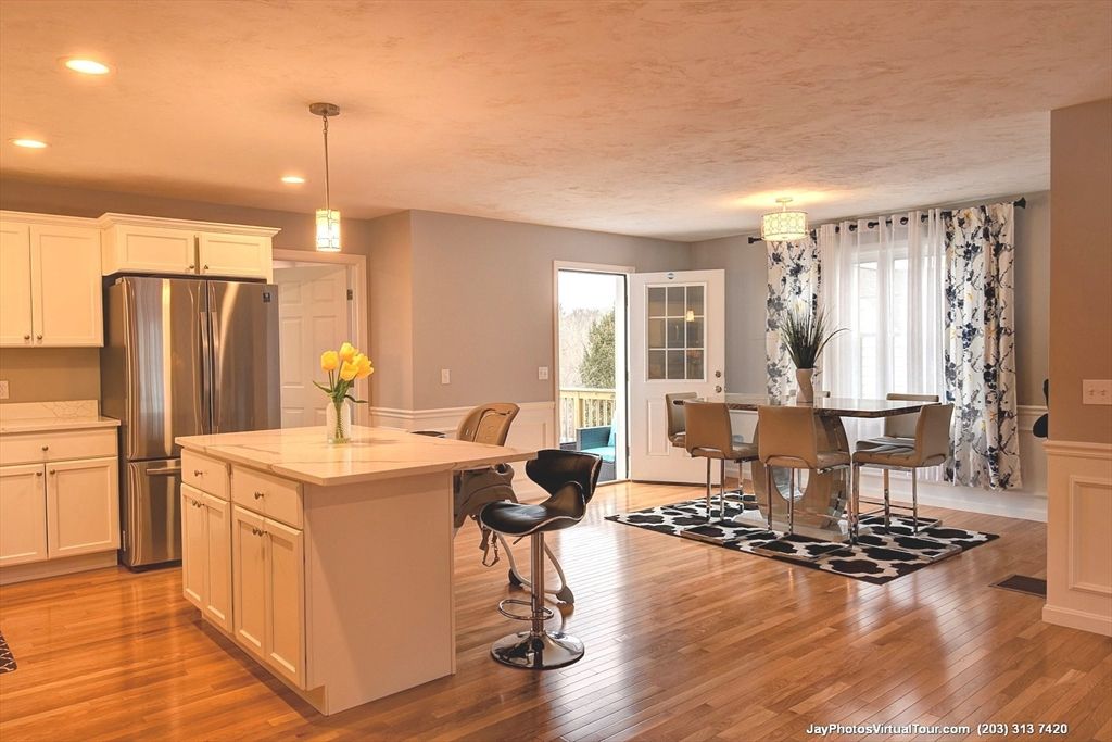 Dining room, Interior, Kitchen, Pendant Lights, Recessed Lighting, Stainless Steel Appliances, Wood Texture Flooring