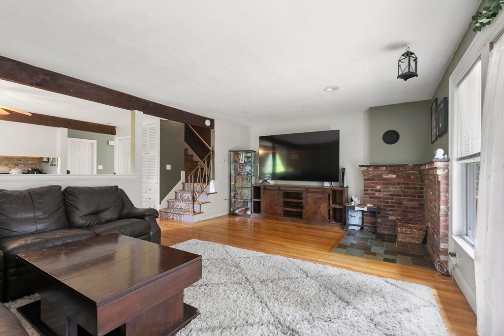 Fireplace, Interior, Living room, Recessed Lighting, Stone Walls, Wood Texture Flooring