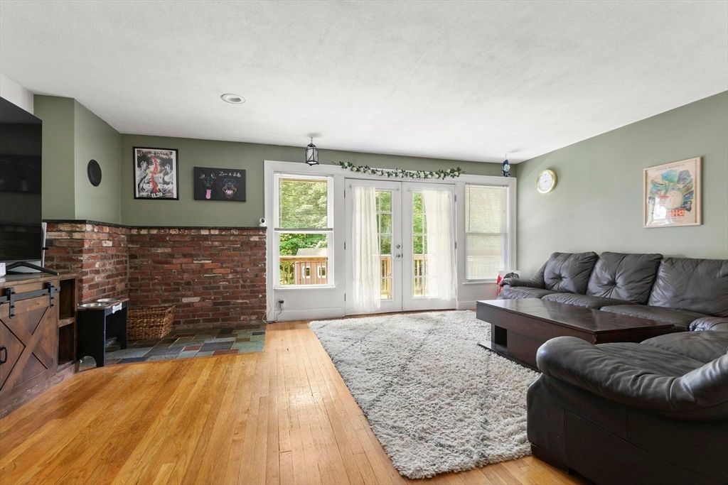 Fireplace, Interior, Living room, Recessed Lighting, Stone Walls, Wood Texture Flooring