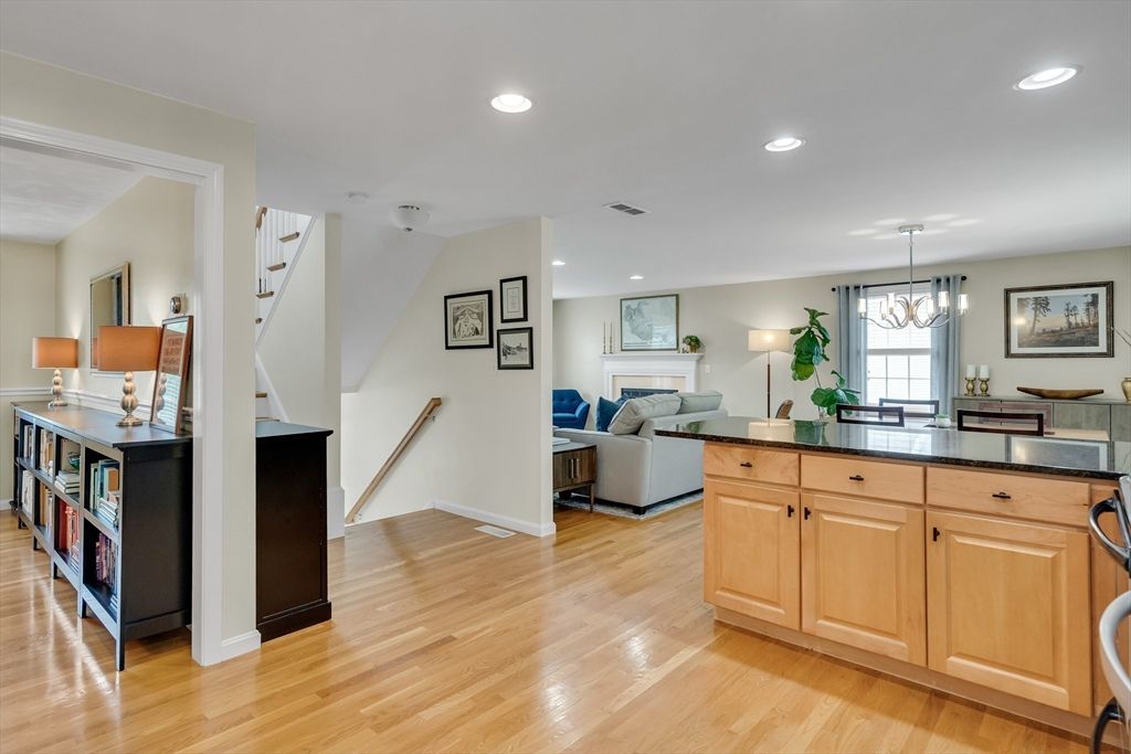 Chandelier, Dining room, Fireplace, Interior, Living room, Recessed Lighting, Wood Texture Flooring