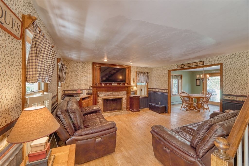 Dining room, Fireplace, Interior, Living room, Recessed Lighting, Wood Texture Flooring
