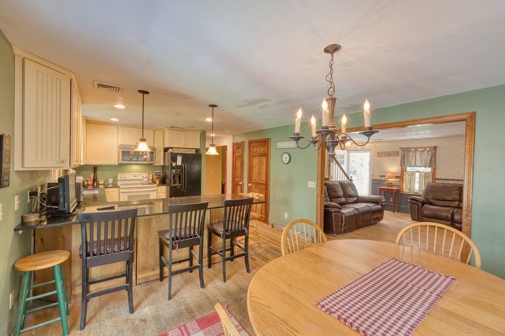 Chandelier, Dining room, Interior, Kitchen, Living room, Pendant Lights, Recessed Lighting, Wood Texture Flooring