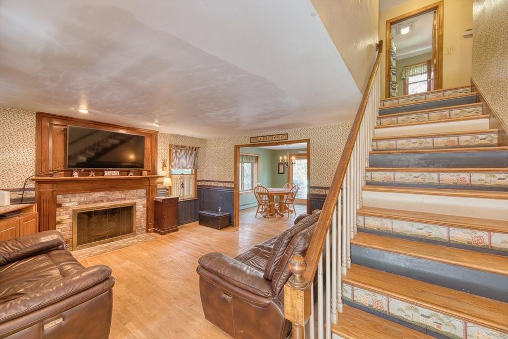 Dining room, Fireplace, Interior, Living room, Recessed Lighting, Wood Texture Flooring