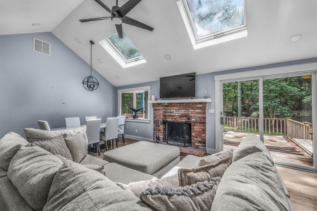 Dining room, Fireplace, Interior, Living room, Recessed Lighting, Wood Texture Flooring