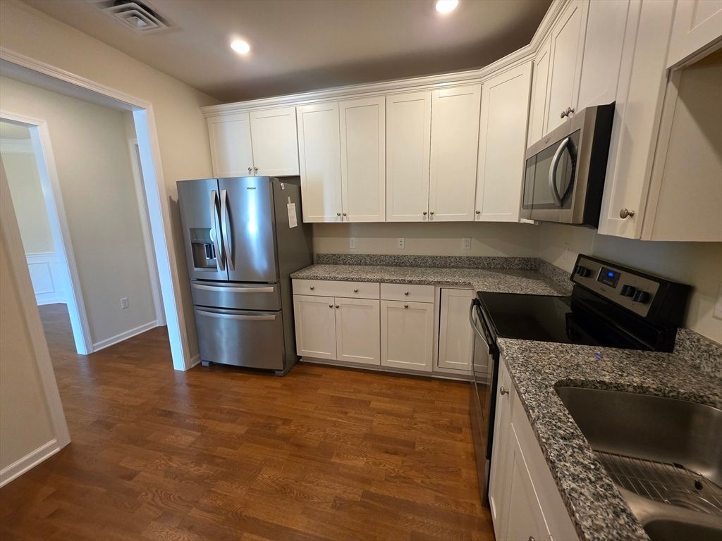 Interior, Kitchen, Recessed Lighting, Washer, Wood Texture Flooring