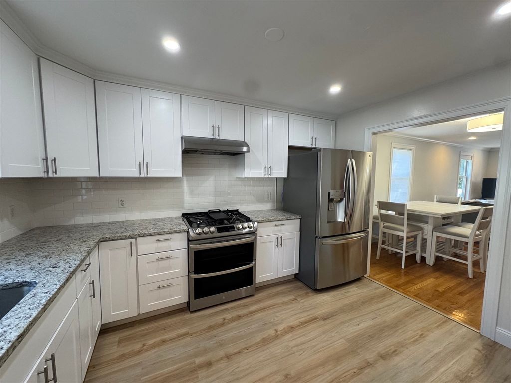 Dining room, Interior, Kitchen, Recessed Lighting, Stainless Steel Appliances, Wood Texture Flooring