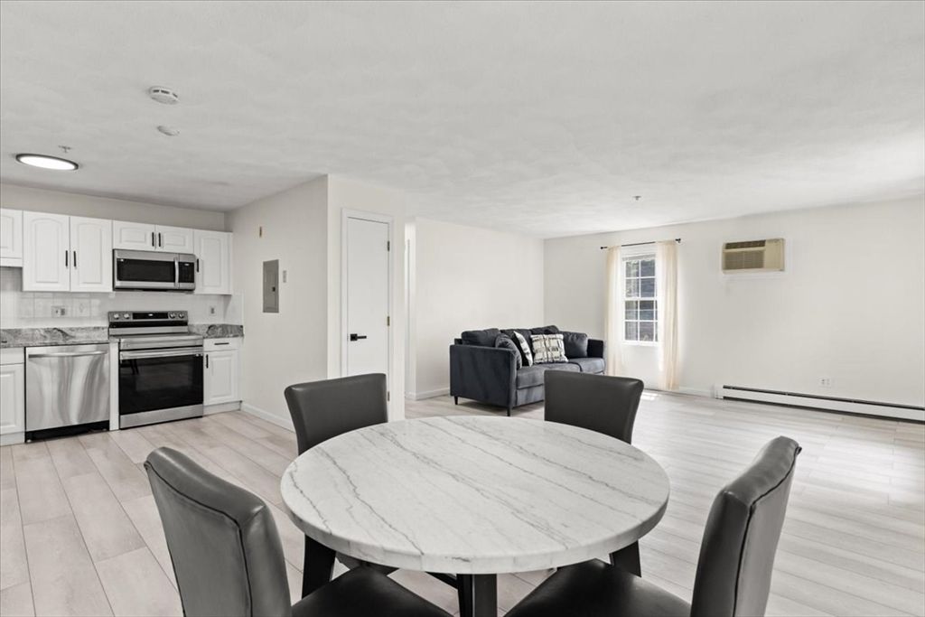 Dining room, Interior, Kitchen, Living room, Recessed Lighting, Stainless Steel Appliances, Wood Texture Flooring