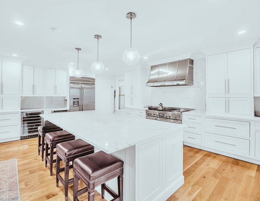 Interior, Kitchen, Marble Walls, Pendant Lights, Recessed Lighting, Stainless Steel Appliances, Wood Texture Flooring