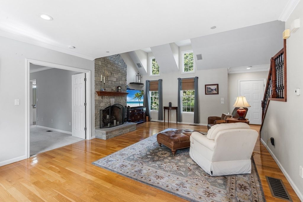 Fireplace, Interior, Living room, Recessed Lighting, Stone Walls, Wood Texture Flooring