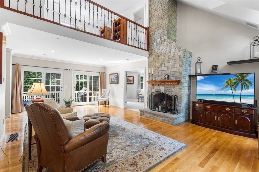 Fireplace, Interior, Living room, Recessed Lighting, Stone Walls, Wood Texture Flooring