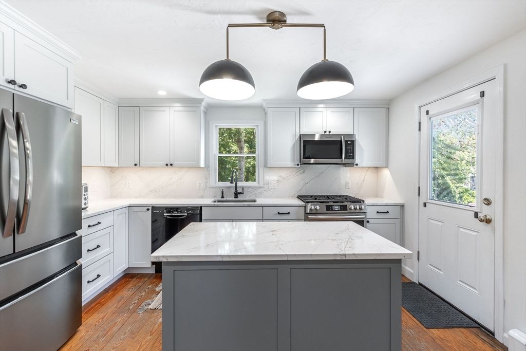 Interior, Kitchen, Marble Walls, Pendant Lights, Recessed Lighting, Stainless Steel Appliances, Wood Texture Flooring