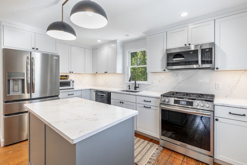 Interior, Kitchen, Marble Walls, Pendant Lights, Recessed Lighting, Stainless Steel Appliances, Wood Texture Flooring