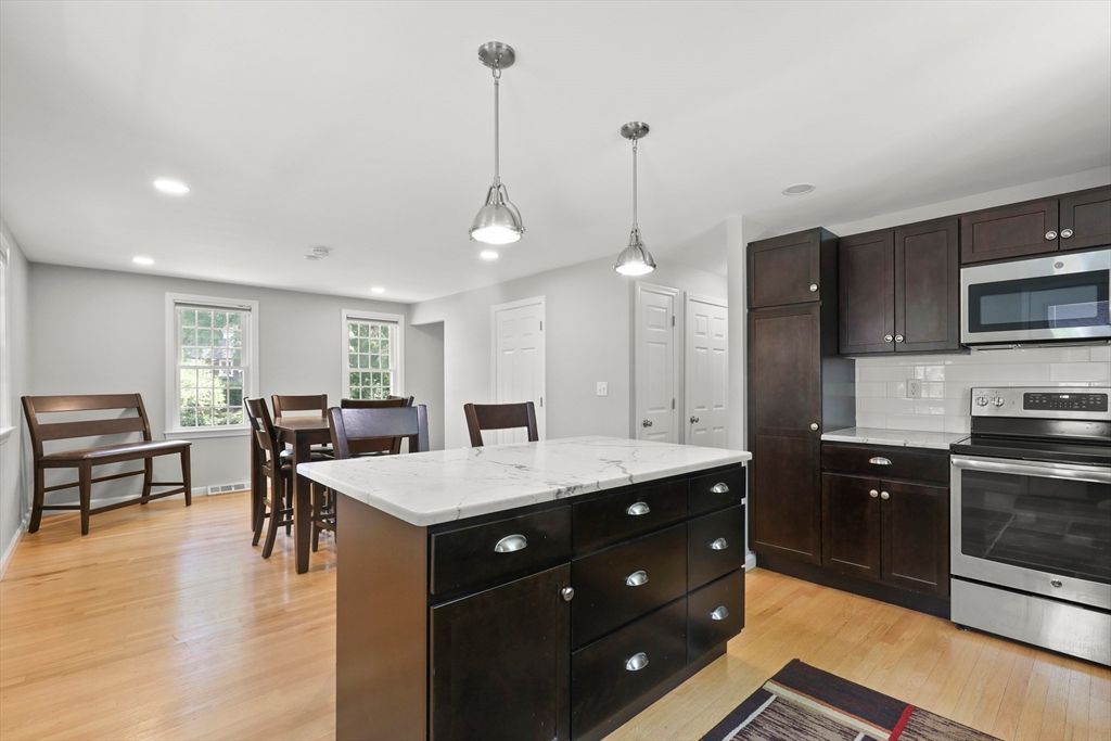 Dining room, Interior, Kitchen, Pendant Lights, Recessed Lighting, Stainless Steel Appliances, Wood Texture Flooring