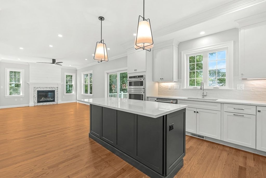 Fireplace, Interior, Kitchen, Pendant Lights, Recessed Lighting, Stainless Steel Appliances, Wood Texture Flooring