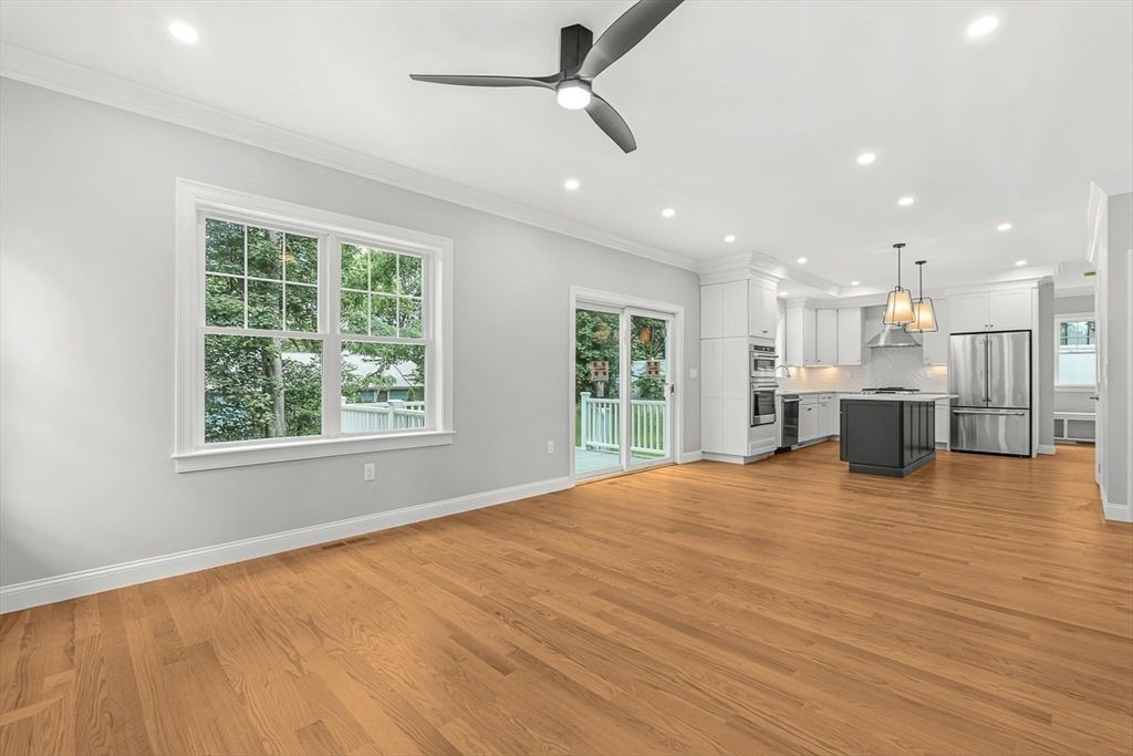 Empty room, Interior, Kitchen, Pendant Lights, Recessed Lighting, Stainless Steel Appliances, Wood Texture Flooring
