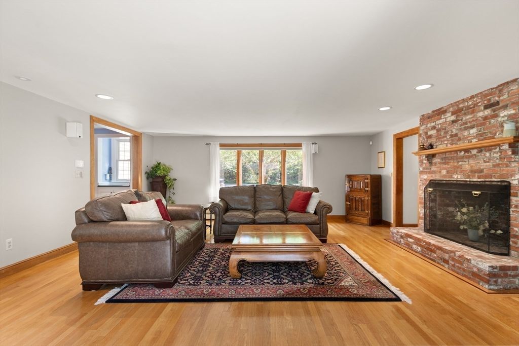 Fireplace, Interior, Living room, Recessed Lighting, Stone Walls, Wood Texture Flooring