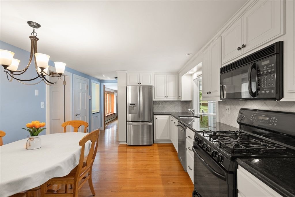 Chandelier, Dining room, Interior, Kitchen, Recessed Lighting, Stainless Steel Appliances, Wood Texture Flooring
