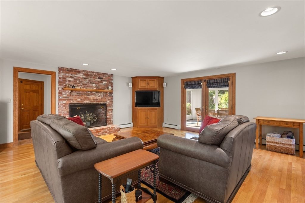 Fireplace, Interior, Living room, Recessed Lighting, Stone Walls, Wood Texture Flooring