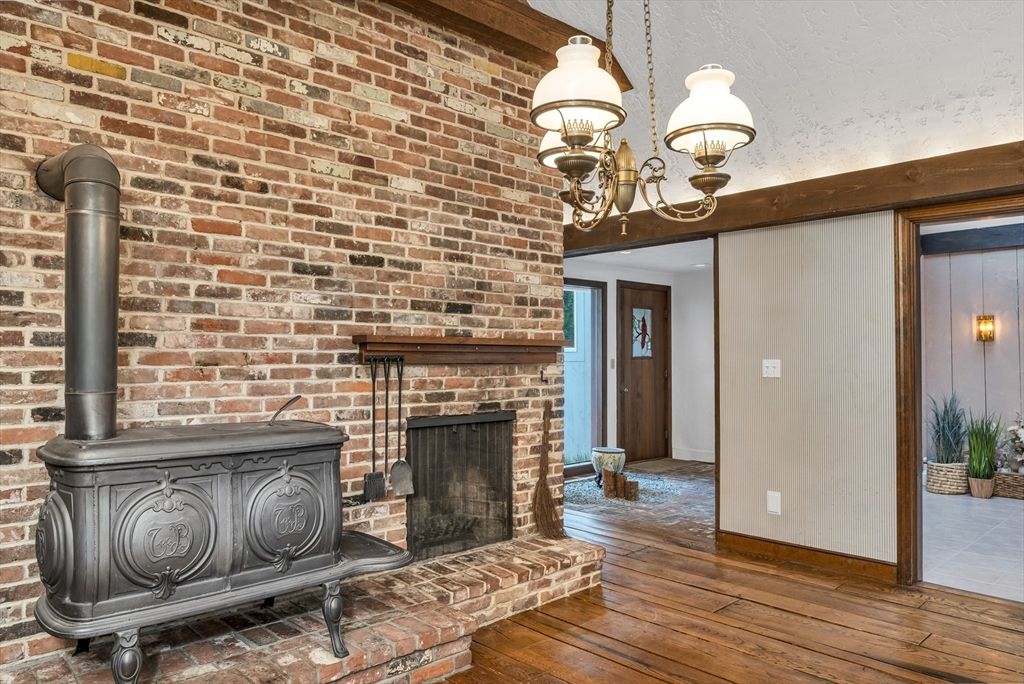 Chandelier, Fireplace, Interior, Stone Walls, Wood Texture Flooring