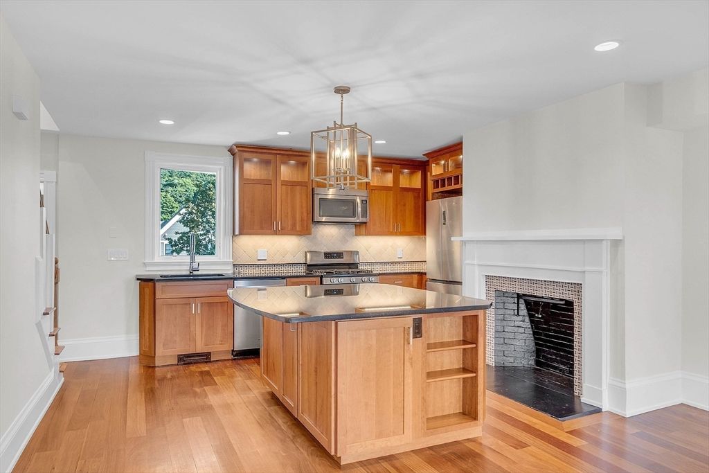 Fireplace, Interior, Kitchen, Recessed Lighting, Stainless Steel Appliances, Wood Texture Flooring