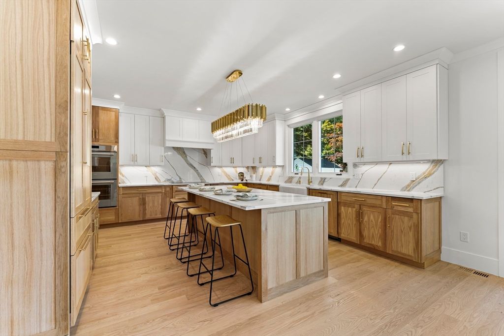 Interior, Kitchen, Marble Walls, Pendant Lights, Recessed Lighting, Stainless Steel Appliances, Wood Texture Flooring