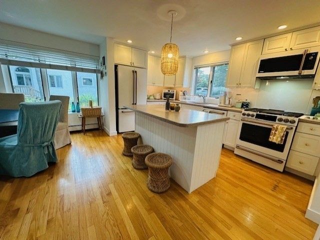 Chandelier, Interior, Kitchen, Pendant Lights, Recessed Lighting, Stainless Steel Appliances, Wood Texture Flooring