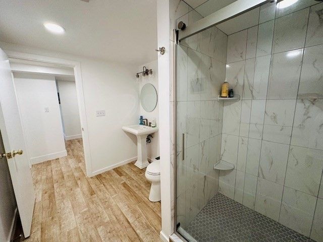 Bathroom, Glass Shower, Interior, Marble Walls, Recessed Lighting, Wood Texture Flooring